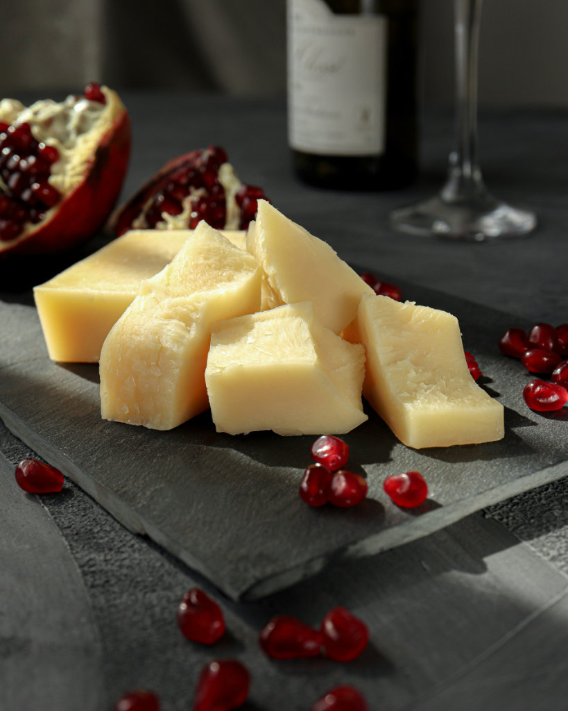 Cheese and red pomegranate seeds