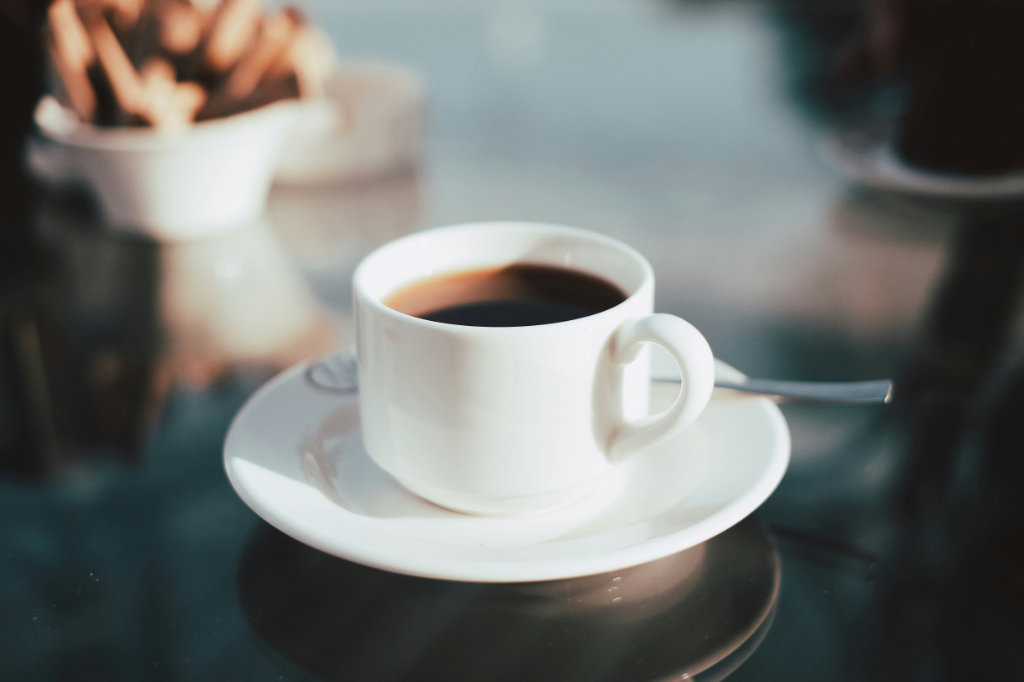 Black cup of coffee in the morning